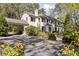 Elegant home featuring a covered driveway, beautiful landscaping, and a well-maintained exterior at 3540 Tuxedo Nw Rd, Atlanta, GA 30305