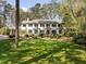 Stately home with a manicured lawn and mature landscaping; features a neutral color palette and classic design at 3540 Tuxedo Nw Rd, Atlanta, GA 30305