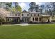 Beautiful home with a large yard, stone patio, and mature trees at 3540 Tuxedo Nw Rd, Atlanta, GA 30305