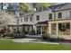 Charming home with a stone patio, pergola, and manicured yard at 3540 Tuxedo Nw Rd, Atlanta, GA 30305
