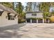 Spacious three-car garage with an extra building, perfect for car collectors or hobbyists at 3540 Tuxedo Nw Rd, Atlanta, GA 30305