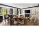 Game room with multiple seating areas and tables, a fireplace, and large windows at 3540 Tuxedo Nw Rd, Atlanta, GA 30305