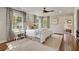 Bright main bedroom with hardwood floors, ensuite access, large windows, and tasteful decor for relaxation at 3540 Tuxedo Nw Rd, Atlanta, GA 30305