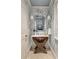 Charming powder room with unique vanity, patterned wallpaper, and decorative mirror at 3540 Tuxedo Nw Rd, Atlanta, GA 30305