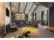 Spacious theater room with projector, bar, comfortable seating, and stylish decor at 3540 Tuxedo Nw Rd, Atlanta, GA 30305