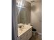 A bathroom with a toilet and sink at 8236 Eastshore Dr, Union City, GA 30291
