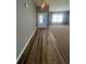 Inviting entryway featuring wood-look tile flooring, a decorative chandelier, and an open view to the living area at 8236 Eastshore Dr, Union City, GA 30291