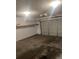 View of empty garage with shelving and functional automatic door at 8236 Eastshore Dr, Union City, GA 30291