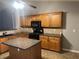 Functional kitchen with a center island, stainless steel appliances, and wooden cabinetry at 8236 Eastshore Dr, Union City, GA 30291
