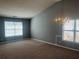 Spacious living room with vaulted ceilings, plenty of natural light, and neutral-toned carpet at 8236 Eastshore Dr, Union City, GA 30291
