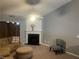 Cozy living room area featuring a fireplace, comfortable seating, and neutral decor at 8236 Eastshore Dr, Union City, GA 30291