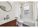This bathroom has modern finishes, including a decorative wood vanity, sleek fixtures, and tile accents at 1800 Charles Nw Pl, Atlanta, GA 30318