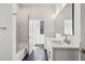 Modern bathroom featuring dual sinks, hexagon tile floors, and a sleek bathtub with marble tile surround at 1800 Charles Nw Pl, Atlanta, GA 30318