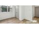 Neutral bedroom with natural light, hardwood flooring, and convenient closet space at 1800 Charles Nw Pl, Atlanta, GA 30318