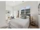 Well-lit bedroom with a balcony access, side tables, and natural light at 1800 Charles Nw Pl, Atlanta, GA 30318