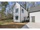 Modern home with clean lines, white siding, black trim, and a well-maintained lawn at 1800 Charles Nw Pl, Atlanta, GA 30318