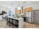 Modern kitchen features a large island, stainless steel appliances, and sleek cabinetry at 1800 Charles Nw Pl, Atlanta, GA 30318