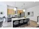Well-appointed kitchen features an island with barstool seating, and modern stainless steel appliances at 1800 Charles Nw Pl, Atlanta, GA 30318