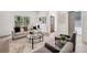 Sun-drenched living room featuring neutral tones, contemporary furnishings, and ample natural light at 1800 Charles Nw Pl, Atlanta, GA 30318