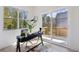 Bright home office with a desk, chair, and sliding glass doors to a private balcony at 1800 Charles Nw Pl, Atlanta, GA 30318