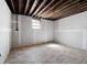 Partially finished basement with wood-look flooring and a small window, ready for personalization to suit your needs at 3042 Peek Nw Rd, Atlanta, GA 30318