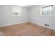 Bedroom featuring hardwood floors, white paint and modern trim around the windows at 3042 Peek Nw Rd, Atlanta, GA 30318