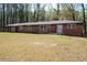 Charming red brick home with a well-manicured lawn and a classic design at 3042 Peek Nw Rd, Atlanta, GA 30318