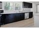 Bright kitchen showcasing black cabinetry, stainless steel appliances, and bright countertops at 3042 Peek Nw Rd, Atlanta, GA 30318