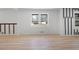 Open-concept living room featuring new floors, neutral paint and large windows at 3042 Peek Nw Rd, Atlanta, GA 30318
