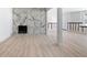 Bright and spacious living room featuring a marble fireplace and new floors at 3042 Peek Nw Rd, Atlanta, GA 30318