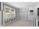 Open-concept living room featuring modern floors and black accent stripes on the wall at 3042 Peek Nw Rd, Atlanta, GA 30318