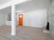 Bright and airy living room featuring new floors, a fireplace and an orange door at 3042 Peek Nw Rd, Atlanta, GA 30318