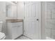 Bathroom featuring a white vanity with granite countertop, tiled walls and floors and a door at 4062 Doster Sw Dr, Atlanta, GA 30331