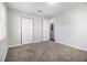 Comfortable bedroom with soft carpeting, neutral walls, and ample closet space for storage at 4062 Doster Sw Dr, Atlanta, GA 30331