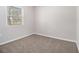 Inviting bedroom with neutral carpeting, freshly painted walls, and natural light at 4062 Doster Sw Dr, Atlanta, GA 30331
