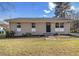 Charming single-story home featuring a neutral brick exterior, black front door, and well-manicured lawn at 4062 Doster Sw Dr, Atlanta, GA 30331