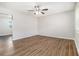 Bright, open living room with sleek flooring, neutral walls and a modern ceiling fan at 4062 Doster Sw Dr, Atlanta, GA 30331