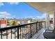 Balcony with a table and chairs overlooking city buildings and a swimming pool at 795 Hammond 1013 Dr, Sandy Springs, GA 30328