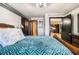 Bedroom featuring hardwood floors, an industrial ceiling, and an open doorway at 795 Hammond 1013 Dr, Sandy Springs, GA 30328