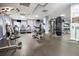 Bright fitness center with rubber floor, ample equipment, treadmills, weight machines, and televisions at 795 Hammond 1013 Dr, Sandy Springs, GA 30328
