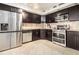 Beautiful kitchen features stainless steel appliances, modern cabinetry, and neutral tile backsplash at 795 Hammond 1013 Dr, Sandy Springs, GA 30328