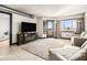 Relaxing living room area with a fireplace and large television, perfect for entertaining and relaxing at 795 Hammond 1013 Dr, Sandy Springs, GA 30328