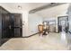 A cozy living space with tile flooring, modern lighting, and a dining set next to a large living room at 795 Hammond 1013 Dr, Sandy Springs, GA 30328