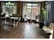 Brightly lit resident lounge with hardwood floors, ample seating, table, and large windows with natural light at 795 Hammond 1013 Dr, Sandy Springs, GA 30328