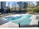Exterior view of sparkling pool surrounded by lounge chairs, tables, and gated fence at 795 Hammond 1013 Dr, Sandy Springs, GA 30328