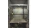 An interior view of storage lockers with metal mesh doors and interior ledge for resident storage at 795 Hammond 1013 Dr, Sandy Springs, GA 30328