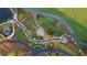 Scenic aerial view showcasing lush landscaping, manicured grounds, and a serene water feature at 225 Rolison Way, Fayetteville, GA 30214