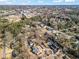 Aerial view of a neighborhood showcasing the landscape, homes, and proximity to city at 417 Lynne Cir, Alpharetta, GA 30009