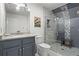 Stylish bathroom featuring modern vanity, unique tile work and a glass enclosed shower at 417 Lynne Cir, Alpharetta, GA 30009
