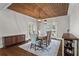 Elegant dining room with hardwood floors, wood-slatted ceiling, and stylish furnishings at 417 Lynne Cir, Alpharetta, GA 30009